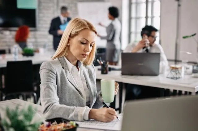 Business owner reviewing hiring strategy at desk